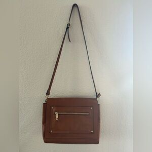 Divina firenze Chic Brown Crossbody Bag with Gold Details.It has a small detail